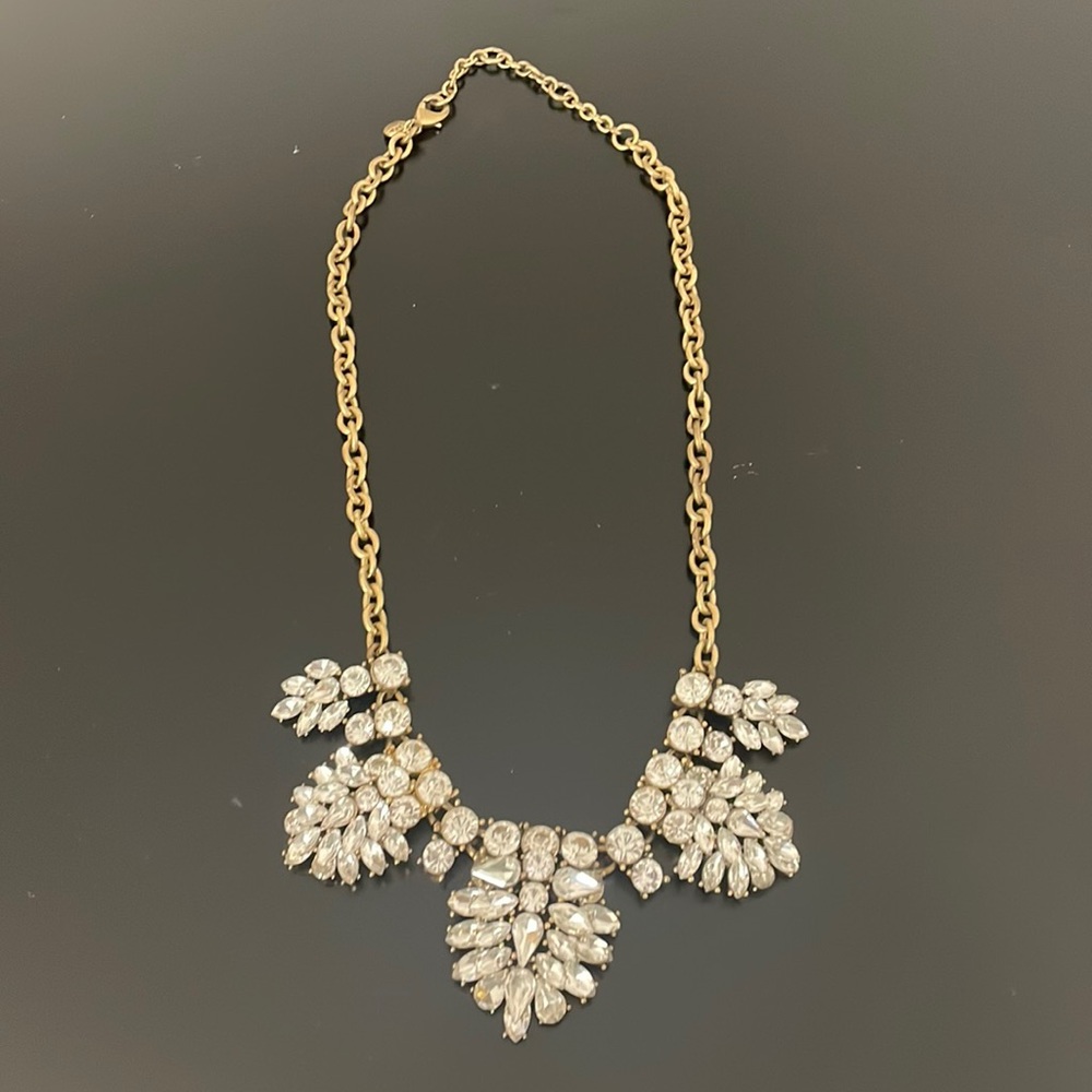 J crew clear gem statement necklace with gold metal.